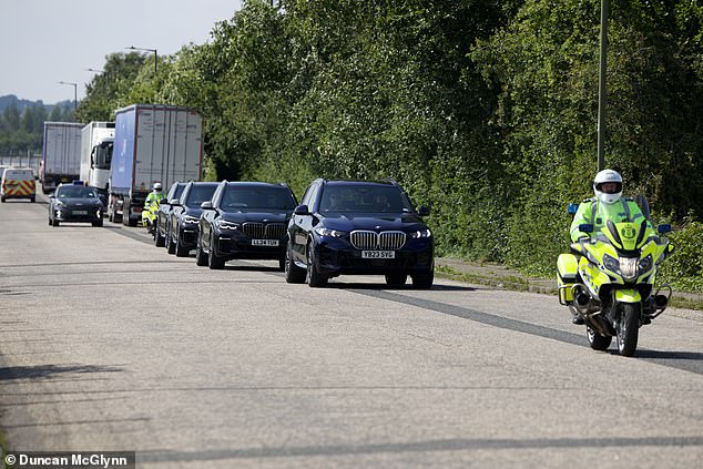 The singer was accompanied by a police escort as she was transported further in a black BMW