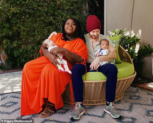 In the photos, the American Horror Story alum wore a stylish orange dress while holding baby Cooper, who looked adorable in a blue and white striped onesie