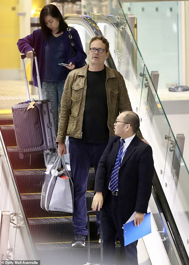 The Swingers actor was also seen carrying a tote bag as he walked to the terminal with airport staff