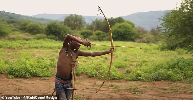 In another scene of the documentary, younger members of the tribe are seen refining their bow and arrow skills