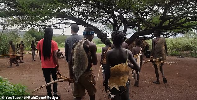 As a form of camouflage, the men wear baboon fur and other animal skins on their heads and around their torsos