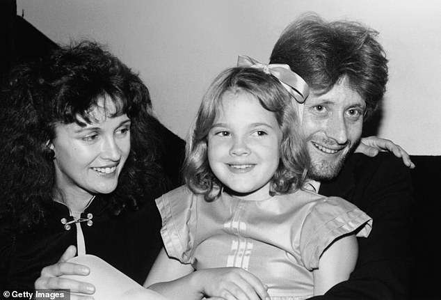 By the time she was 13, she was at the 'lowest' point of her life and went to rehab twice in hopes of turning her life around (she is seen with her parents in 1982)