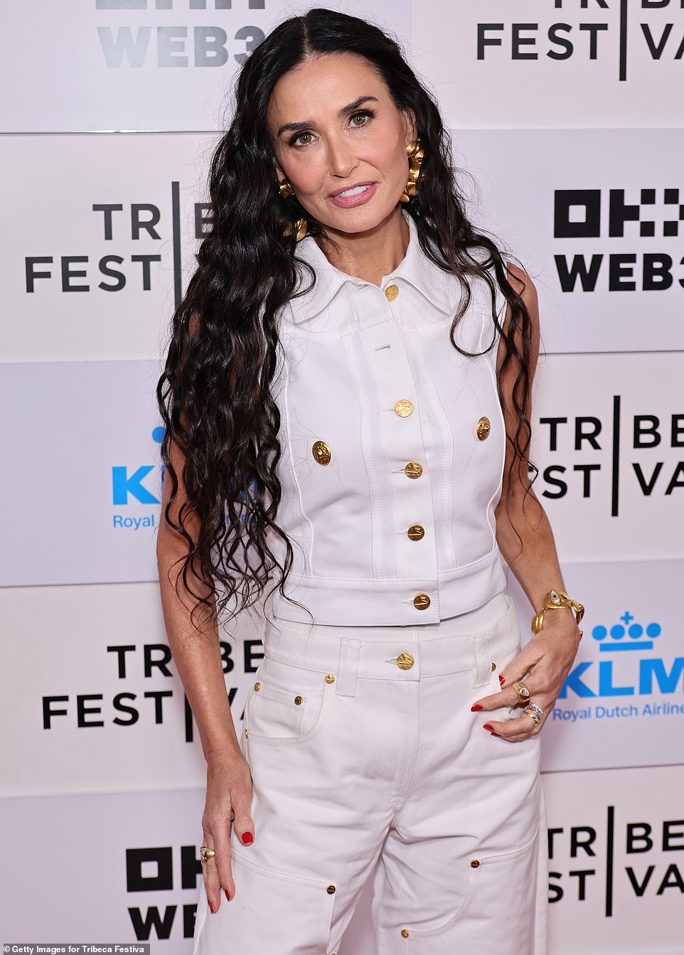 Bruce Willis' ex-wife let her luscious dark hair flow freely over her shoulders and accessorized her look with dainty earrings and a matching bracelet.