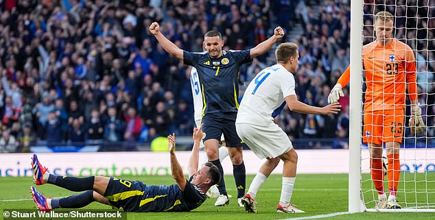 John McGinn celebrates as Shankland's header produces the loudest cheer of the night