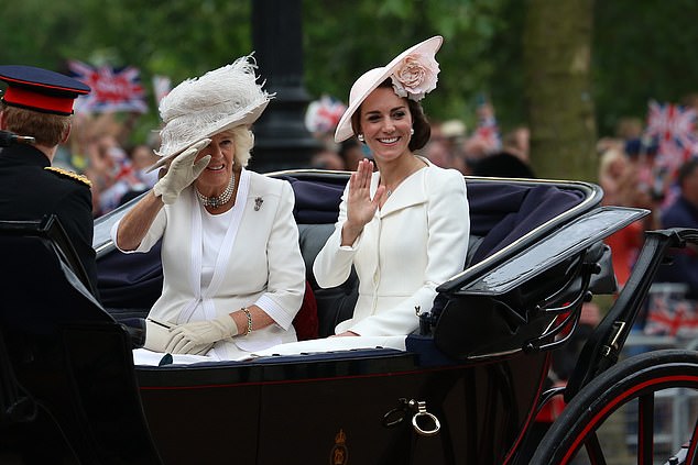 Camilla's coat lay over a cream dress.  Both royals wore similar hats with delicate floral accents that completed their individual yet harmonious styles