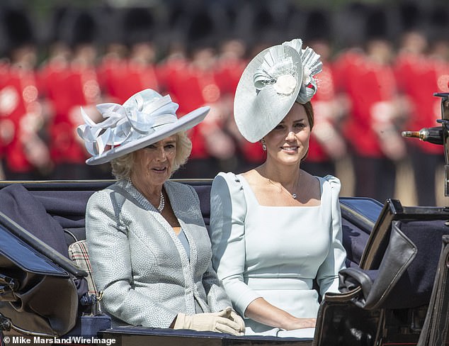 Camilla paired in a powder blue Fiona Clare coat and dress, adorned with classic yet statement pearl jewels (as opposed to Kate's diamonds)