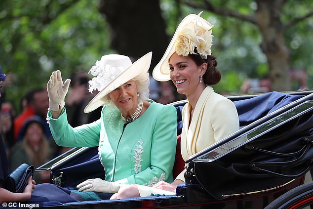 The complementary tradition continued in 2019 with Kate in a pale yellow Alexander McQueen dress and the Duchess of Cornwall in a pastel green ensemble with matching detail