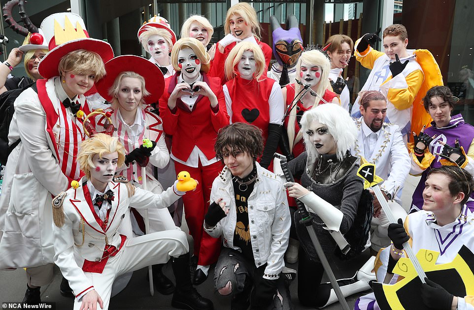 An immaculately dressed group posed for a photo at the well-attended meeting on Saturday