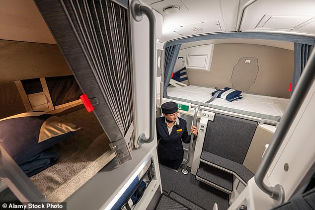 A Lufthansa cabin crew member stands in the cabin crew rest and sleeping area of ​​an Airbus A350-900