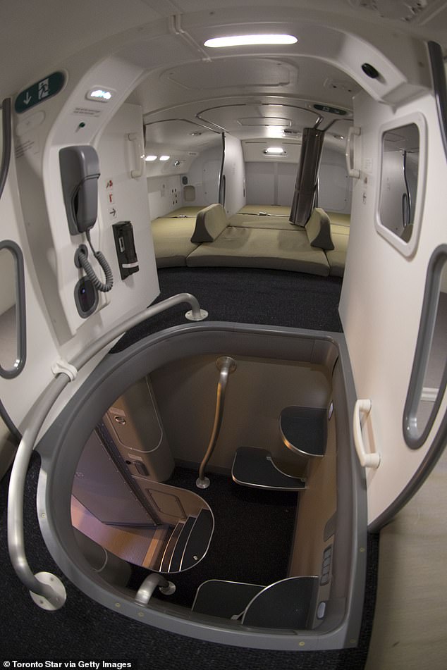 A small staircase leads to a compartment with berths for long-haul crew members on the 787 Dreamliner