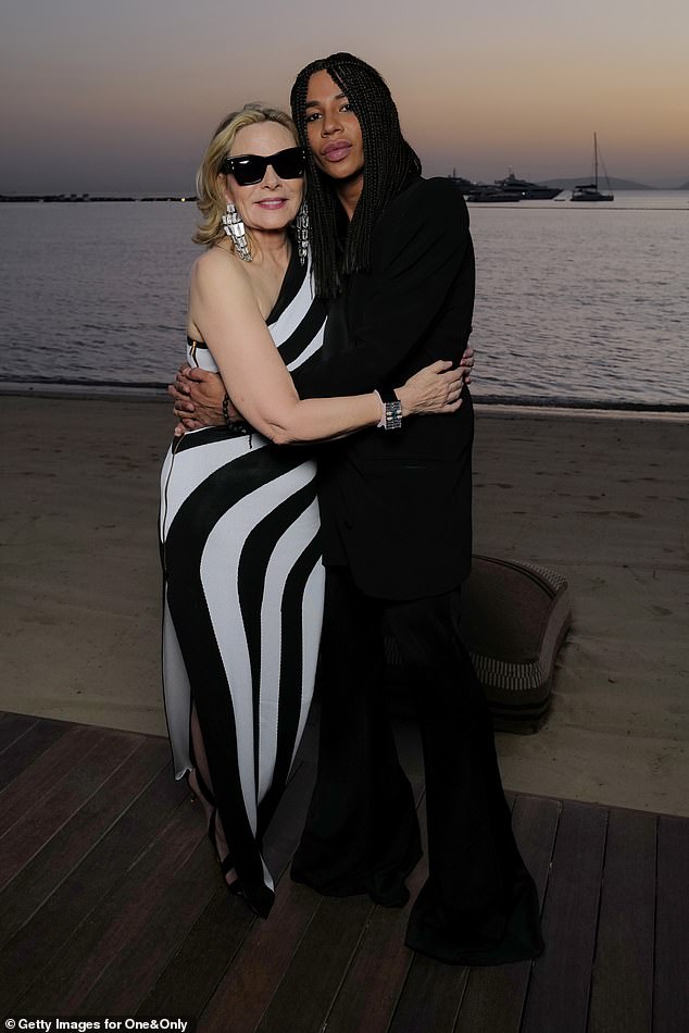 The Glamorous star was also photographed hugging famed French designer Olivier Rousteing as the pair posed behind a beautiful sunset