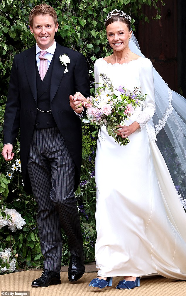 NEWWED: Hugh Grosvenor and Olivia Henson, the Duke and Duchess of Westminster) beam as they leave Chester Cathedral after their wedding ceremony