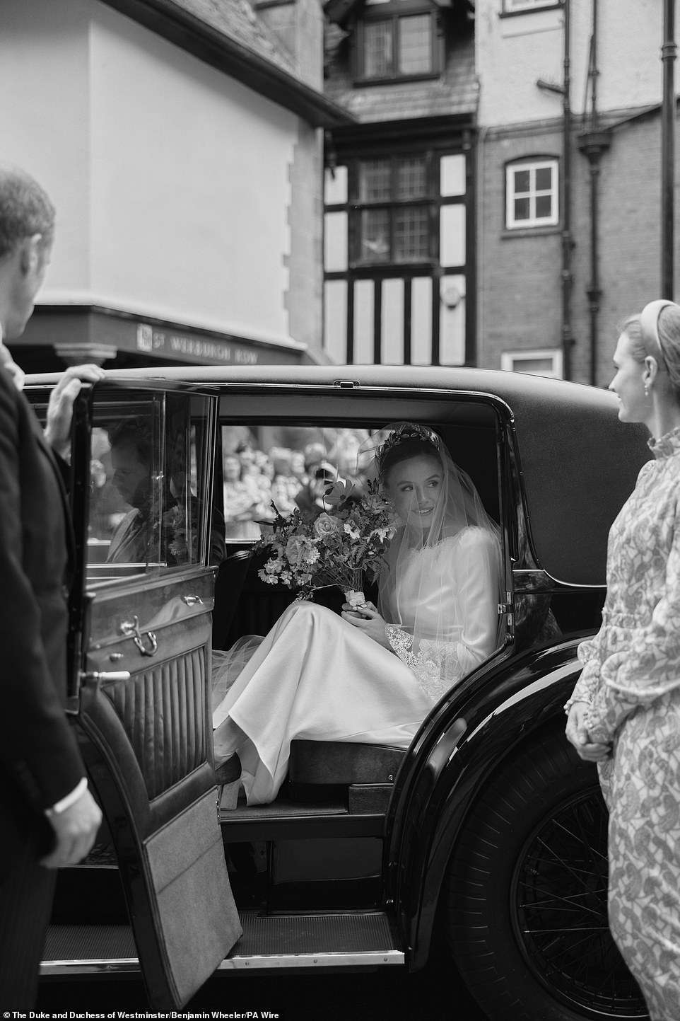 The bride in her car taking her to the wedding