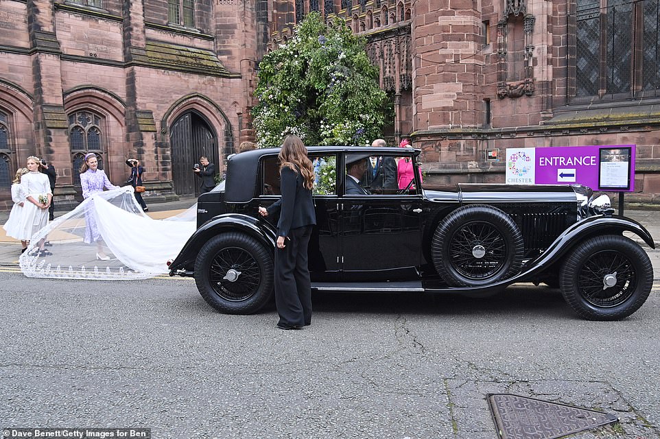 Olivia and her husband, the Duke of Westminster, leave their wedding ceremony at Chester Cathedral