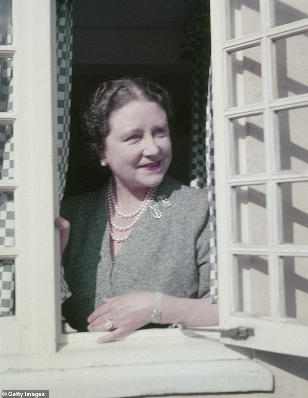 The Queen Mother at a window in the small Welsh house in the grounds of the Royal Lodge