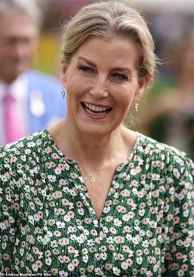 The radiant royal wore a matching floral print dress for her appearance at the flower show today