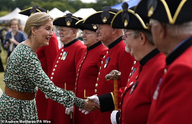 The Duchess of Edinburgh (pictured, left) meets Chelsea pensioners, chats and shakes hands