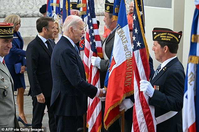 Biden met French military veterans at the ceremony just after noon on Saturday