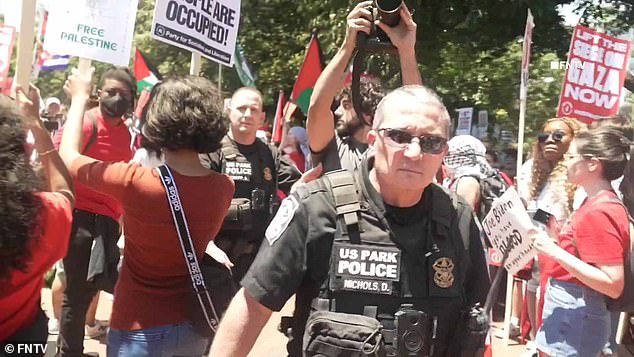 Officers were seen pushing their way through the crowd to chants of 'Free Palestine' and 'f*** the Police'