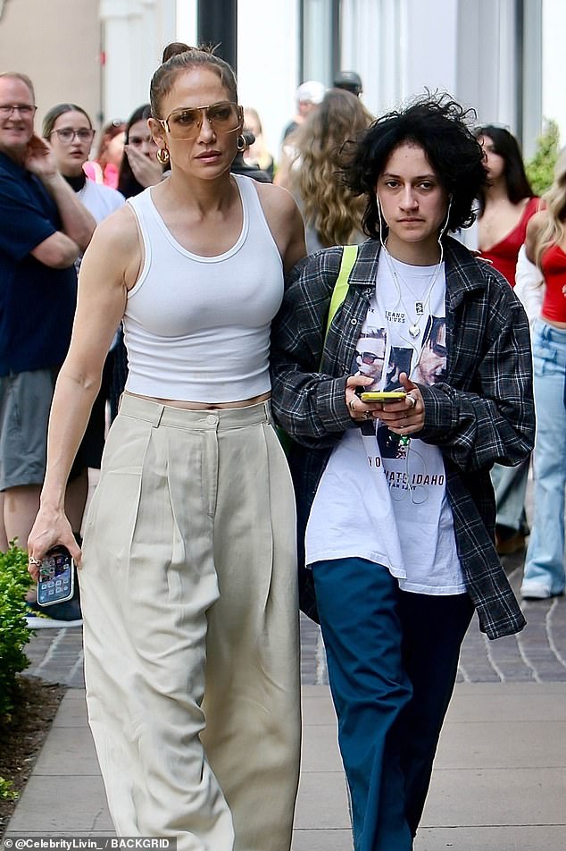 She kept her famous locks tied in a bun as she walked through the busy downtown mall with her teen