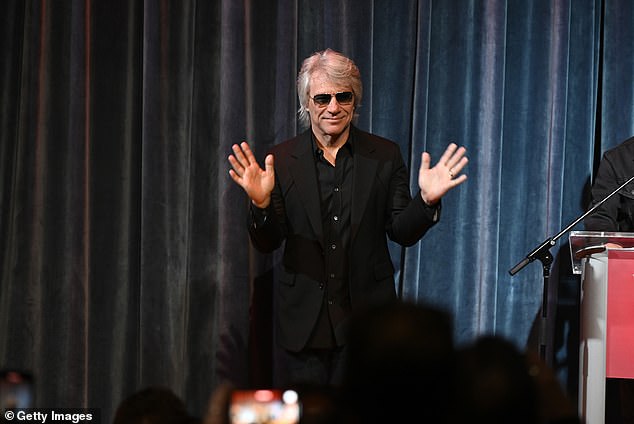 Dressed in a black shirt and matching jacket, the iconic rock star oozed charm as he flashed his megawatt smile before taking his seat for a Q&A