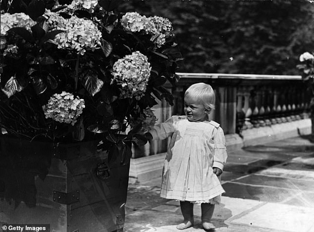 After moving from Greece, Prince Philip, pictured as a toddler in July 1922, lived with relatives for his first years.