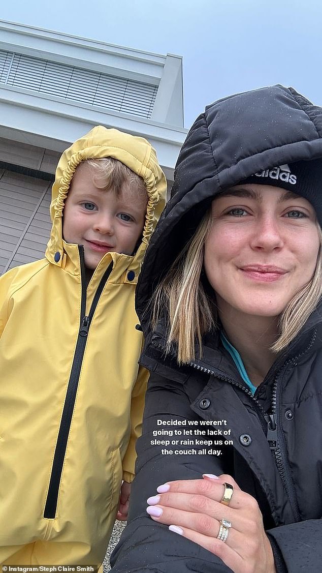 The blonde later returned to Instagram with a smiley photo of herself and Harvey dressed in raincoats as they took a walk outside