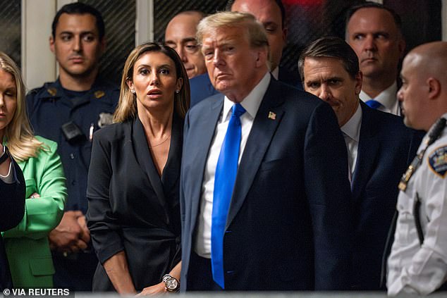 Alina Habba stands behind Trump as he leaves the courthouse after 12 jurors found him guilty on all 34 counts of falsifying company records