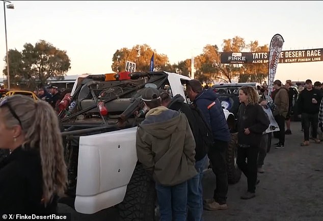 Spectators had been warned by race organizers to be careful when lighting fires and to ensure all fires are extinguished when people have finished using them (spectators gathered at a checkpoint on part of the Finke Desert race track)
