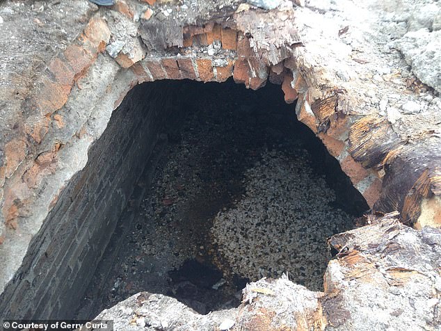 The tunnel walls are constructed from several layers of masonry