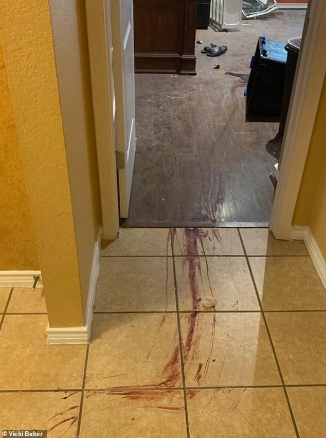 Grim photos of Baker's home after the July 2020 raid show blood-stained hallways