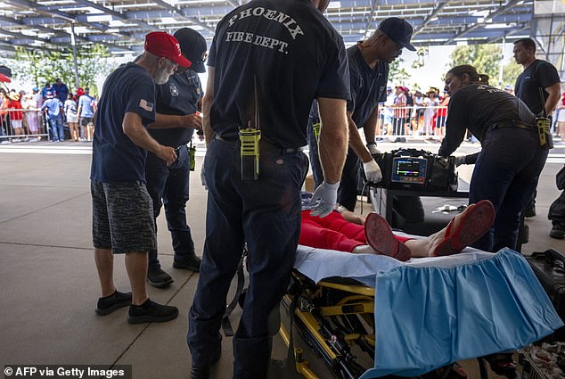A Trump supporter is being treated for exhaustion in Phoenix on Thursday after crowds waited for hours outside the event, held at a megachurch, as temperatures reached 110 degrees