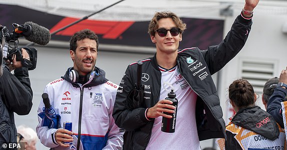 epa11400272 Mercedes driver George Russell of Great Britain and RB driver Daniel Ricciardo of Australia arrive for the drivers' parade ahead of the Formula 1 Grand Prix of Canada, in Montreal, Quebec, Canada, June 9, 2024. EPA/SHAWN THEW