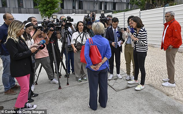 Marta Temido, Socialist Party leader for the EU Parliament, talks to journalists after casting her vote for the European elections in Escola