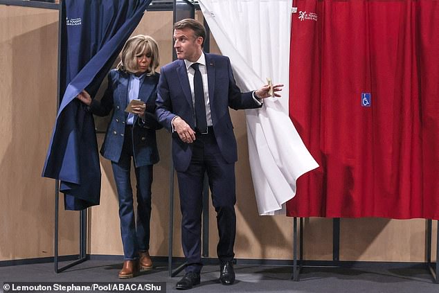 Brigitte Macron and President Emmanuel Macron cast their votes for the European Parliament elections at a polling station in Le Touquet, northern France