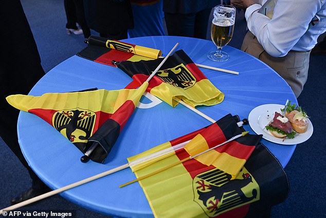 German flags are depicted on a table during the election night of the far-right Alternative Fur Deutschland (AfD)