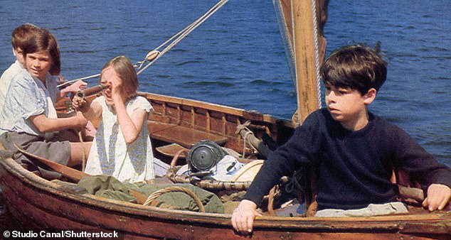 The former child star, who played Titty Walker (pictured second right in the film), brought along memorabilia from the set, including pirate flags and a bow and arrow