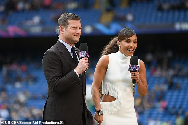 The dress also had a fringed edge and she added extra height to her frame with a pair of stylish heels (pictured with Dermot O'Leary)