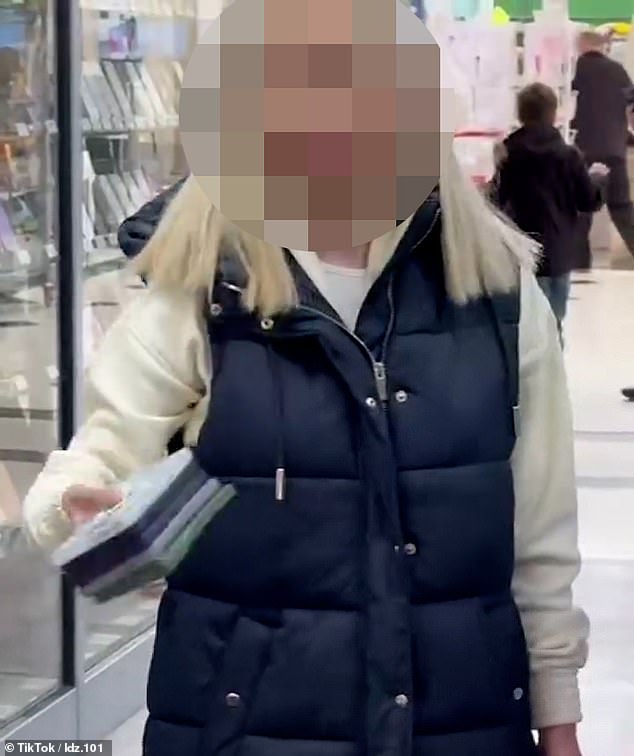 The woman pulled dozens of phone cases off the shelves and threw them on the floor during the rampage at ElectTronex in Market Square in Uxbridge on Saturday