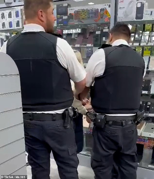 Separate images show the woman being handcuffed by three police officers in the store