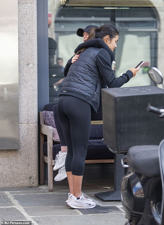 The tennis star hugs Made In Chelsea star Heloise Agostinelli as she drinks a cup of coffee outside a gym in London