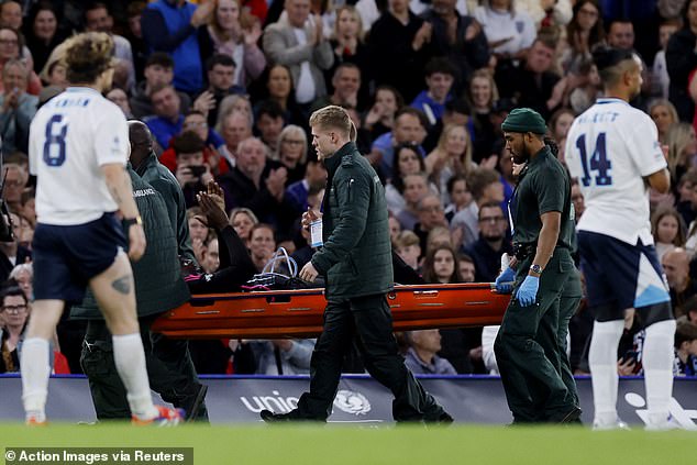 Bolt was then carried off the pitch on a stretcher as he applauded the fans in attendance