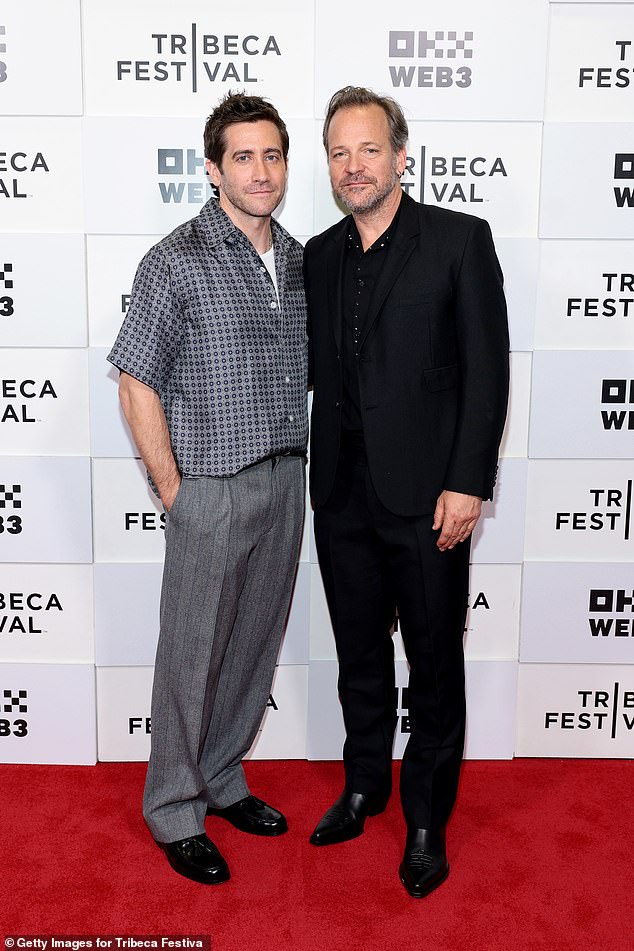 Jake Gyllenhaal poses with brother-in-law Peter Sarsgaard at the premiere of Presumed Innocent