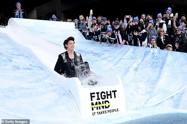 Jack Riewoldt came down the slide next, dressed as Brandon Flowers from The Killers