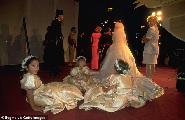 The young bridesmaids wore gold dresses with puffed sleeves and flower crowns