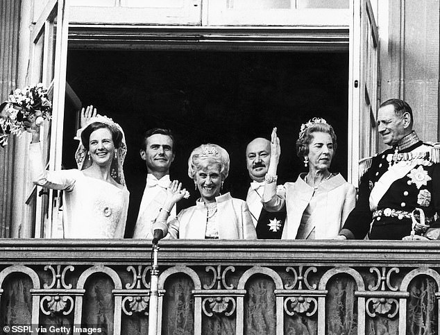 The newlyweds were joined by their delighted parents on the balcony