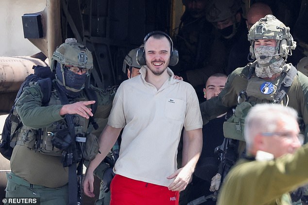 Andrei Kozlov, a released hostage, reacts after the army said Israeli forces rescued four hostages alive from the central Gaza Strip on Saturday