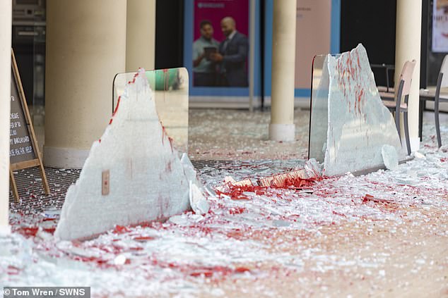 BRISTOL: Giant shards of glass protrude from the remains of the shattered window