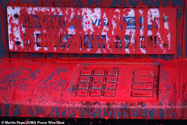 WESTMINSTER: Branch cash machines are covered in red paint