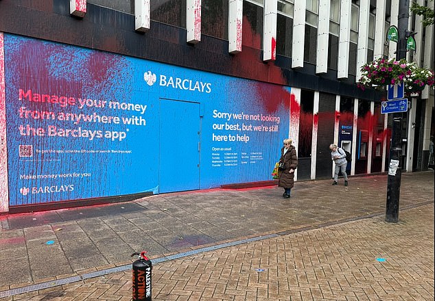 CROYDON: A Barclays sign in Croydon next to the branch was splashed with paint